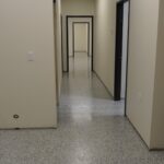 a hallway painted in white coated with polyaspartic coatings by Hanson painting service