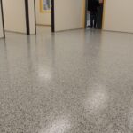 nicely done Dakota Bean project of a floor coated with polyaspartic flooring by Hanson Painting service