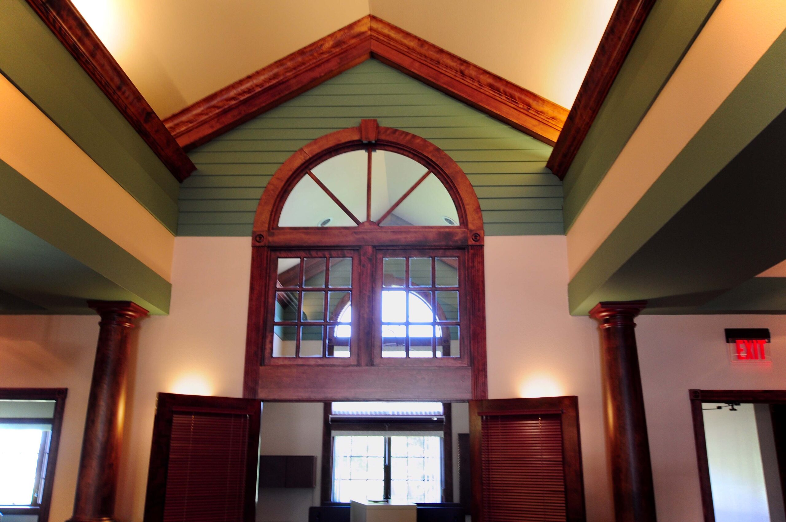 interior office building painted green and a brown stain by Hanson Painting Service of devils Lake ND